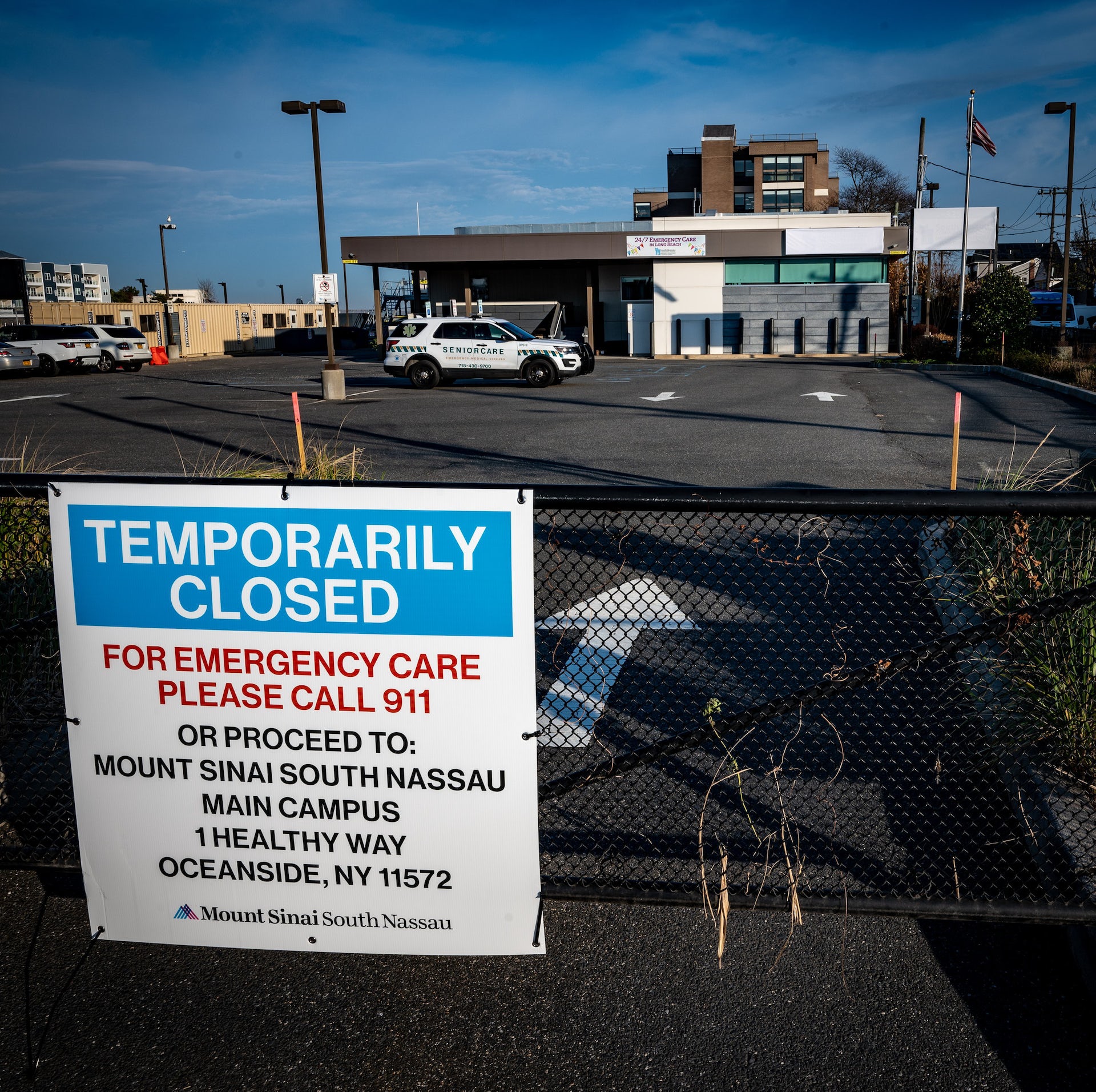 A sign announced an emergency room is closed because of the pandemic.