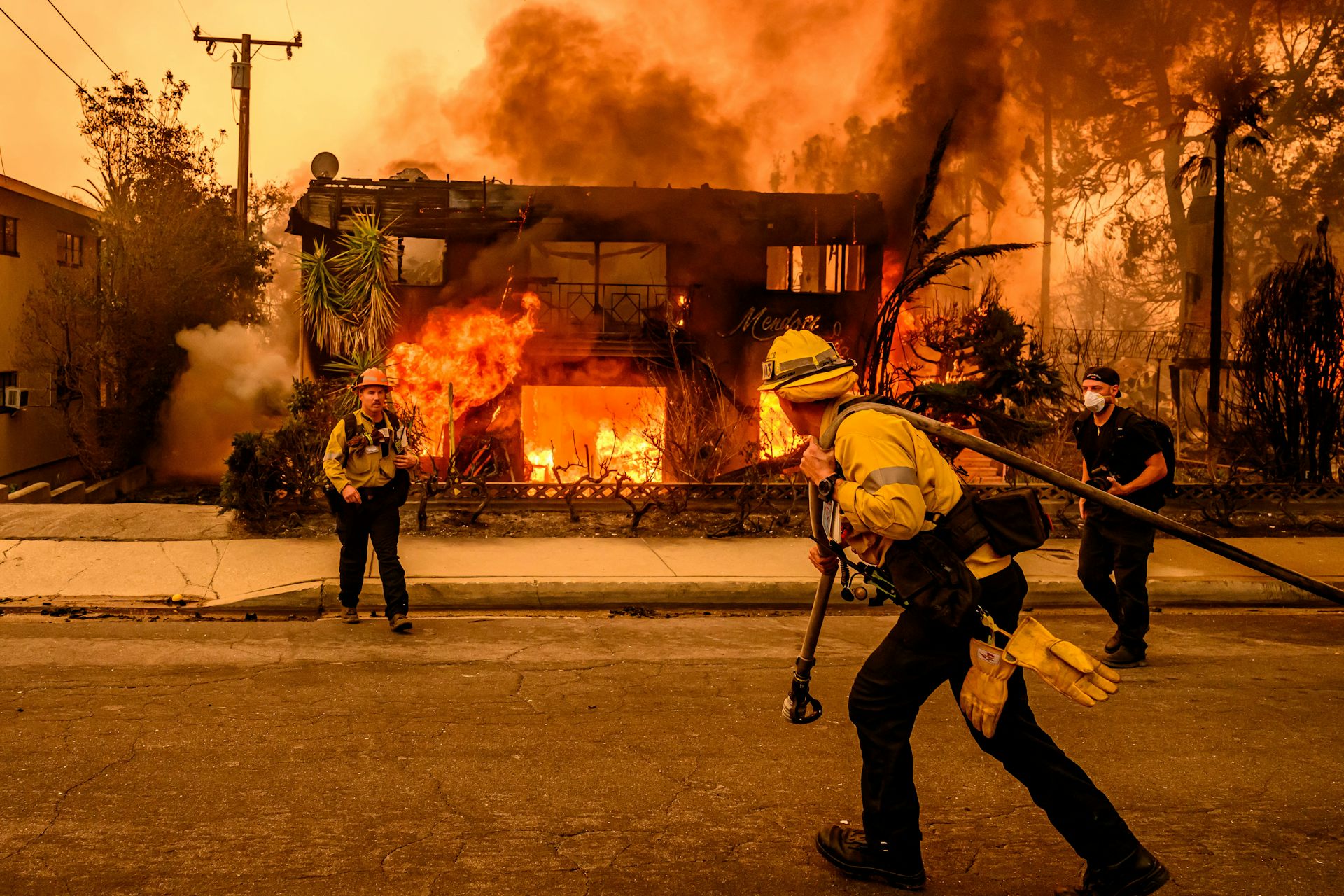 As an apartment building becomes engulfed in flames, two firefighters struggle to stop the fire.